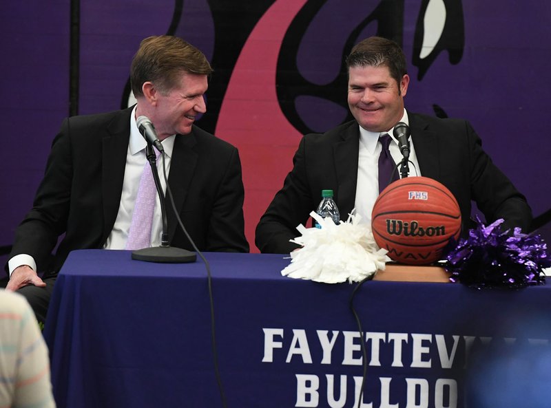 NWA Democrat-Gazette/J.T. WAMPLER Fayetteville boys basketball coach Kyle Adams (LEFT) smiles Wednesday April 10, 2019 after announcing his retirement after 37 years of coaching. Assistant coach Brad Stamps (RIGHT),was named as the new head coach at Fayetteville.