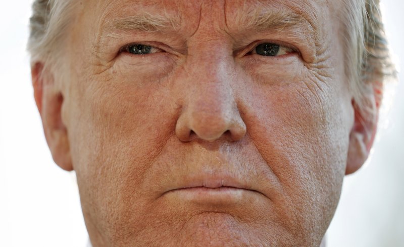 President Donald Trump pauses while speakings to members of the media on the South Lawn of the White House in Washington, before boarding Marine One helicopter, Wednesday, April 10, 2019. (AP Photo/Pablo Martinez Monsivais)