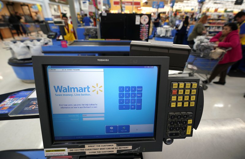 This Nov. 9, 2018, file photo shows a checkout scanner at a Walmart Supercenter in Houston. Walmart says it’s buying San Francisco-based ad tech startup Polymorph Labs as it looks to better compete with online rival juggernaut Amazon in targeting shoppers online. The world’s largest retailer has been quietly building its own advertising business with a unit called Walmart Media Group though that business is still smaller than Amazon’s. (AP Photo/David J. Phillip, File)

