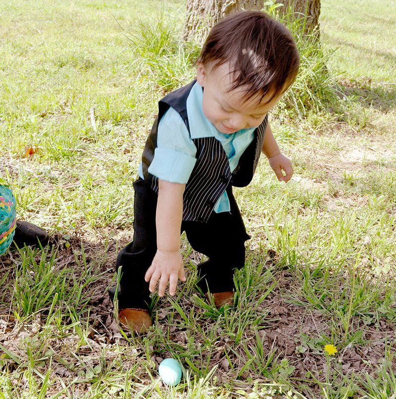 Roman Koppe finds an egg at the 2017 Noel Easter Egg hunt at Sycamore Landing.