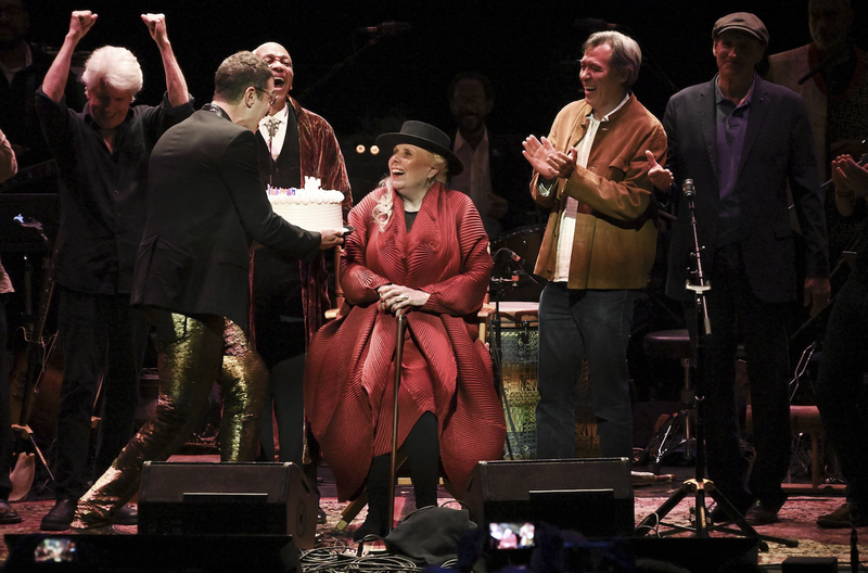 Joni Mitchell is presented with a birthday cake onstage during Joni 75: A Birthday Celebration on Nov. 7 in Los Angeles. (The Associated Press)
