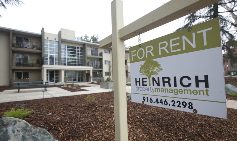 This Jan. 8, 2017, file photo shows a "For Rent" sign outside an apartment building in Sacramento, Calif. The growth in apartment rents is accelerating this year, fueled by increasing demand amid strong job growth, rising wages and more millennials seeking to move out on their own. (AP Photo/Rich Pedroncelli, File)