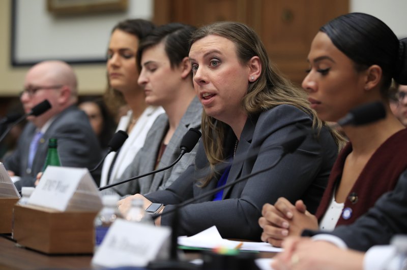 In this Feb. 27, 2019 file photo, Army Staff Sgt. Patricia King, second from right, together with other transgender military members, from left, Navy Lt. Cmdr. Blake Dremann, Army Capt. Alivia Stehlik, Army Capt. Jennifer Peace and Navy Petty Officer Third Class Akira Wyatt, testify about their military service before a House Armed Services Subcommittee on Military Personnel hearing on Capitol Hill in Washington.  (AP Photo/Manuel Balce Ceneta, File)
