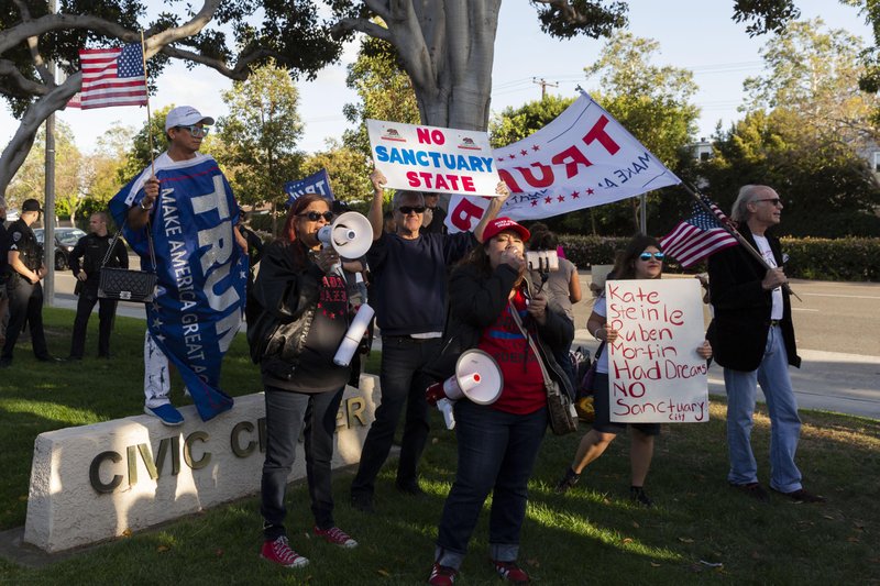 Protesters rally against a sanctuary-city law outside the Los Alamitos, California, City Hall in April 2018. For The Washington Post by Philip Cheung.
