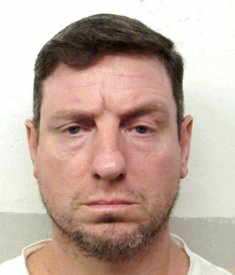 This undated file photo provided by the Alabama Department of Corrections shows Christopher Lee Price. A federal judge on Thursday evening, April 11, 2019, has halted the planned execution of Price, who was convicted of the sword-and-dagger stabbing death of a pastor. U.S. District Judge Kristi K. DuBose issued the stay two hours before the scheduled lethal injection of 46-year-old Price. (Alabama Department of Corrections via AP, File)