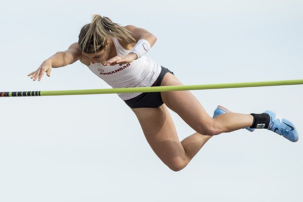 Tori Hoggard of Arkansas clears the bar at 14 feet 6 1/4 inches Friday, April 12, 2019, during the women's pole vault at the John McDonnell Invitational at John McDonnell field in Fayetteville. Hoggard won the event.