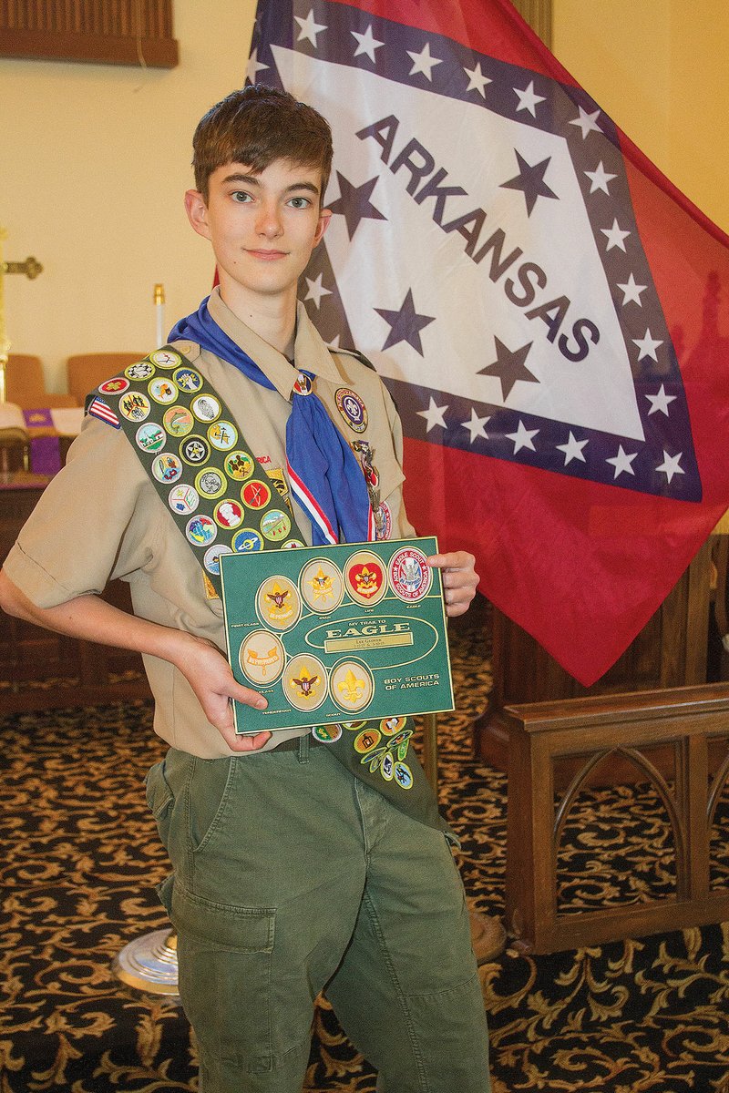 Lee Glover Langdon of Lonoke holds one of his many awards that signify his accomplishment of the Eagle Scout rank. Langdon, 15, is a member of Troop 101 in Carlisle.