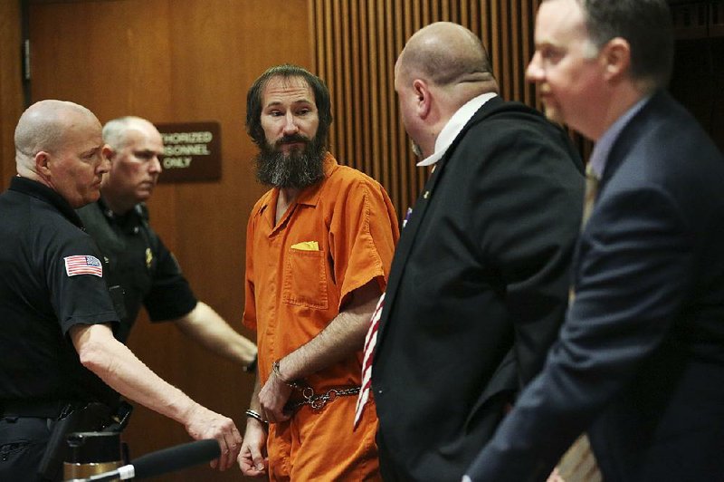 Johnny Bobbitt (center) is led away from his attorneys, John Keesler (second from right) and Stephen P. Hunter, after his sentencing hearing at Burlington County Superior Court in Mount Holly, N.J., on Friday. 