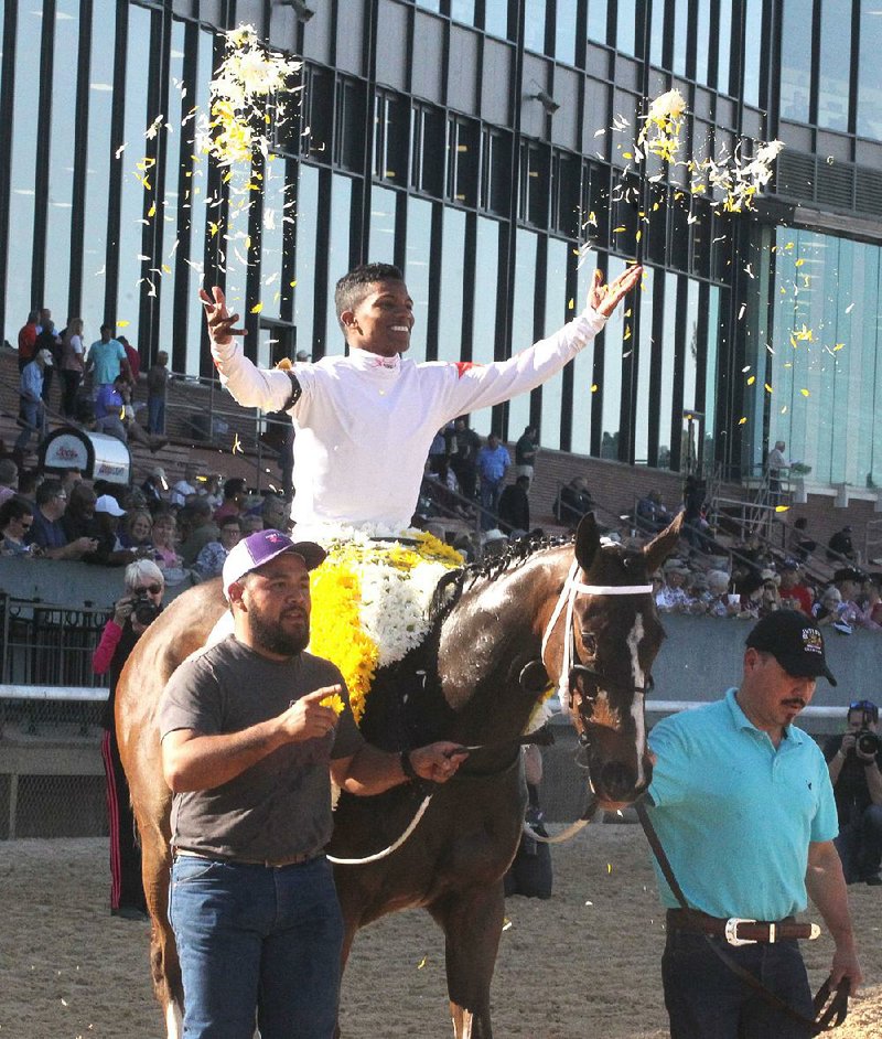 Jockey Ricardo Santana Jr. celebrates aboard Lady Apple after winning the Fantasy Stakes on Friday at Oaklawn Park.