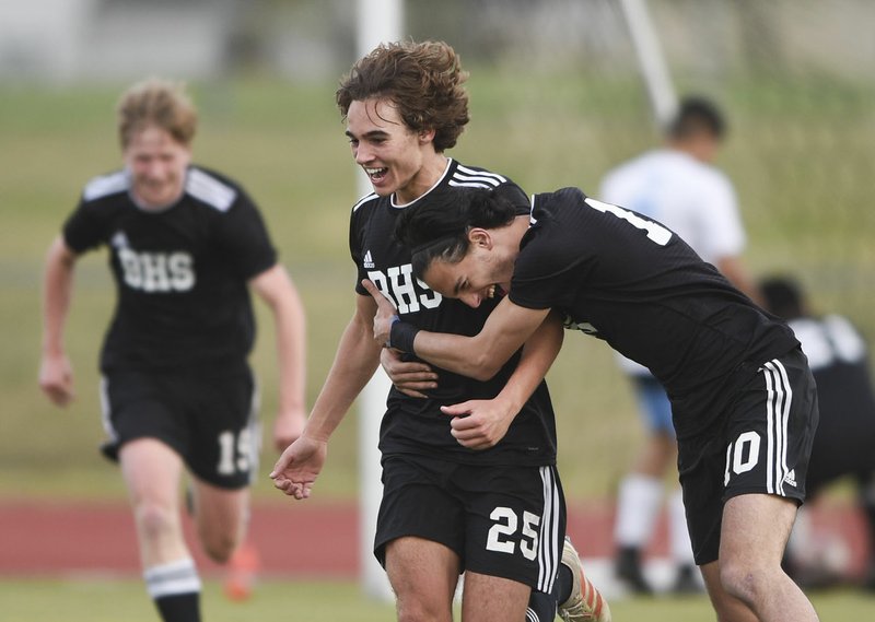 NWA Democrat-Gazette/CHARLIE KAIJO Bentonville High School Frank Suchara (25) reacts after a score during a soccer game, Friday, April 12, 2019 at Tiger Athletic Complex in Bentonville.