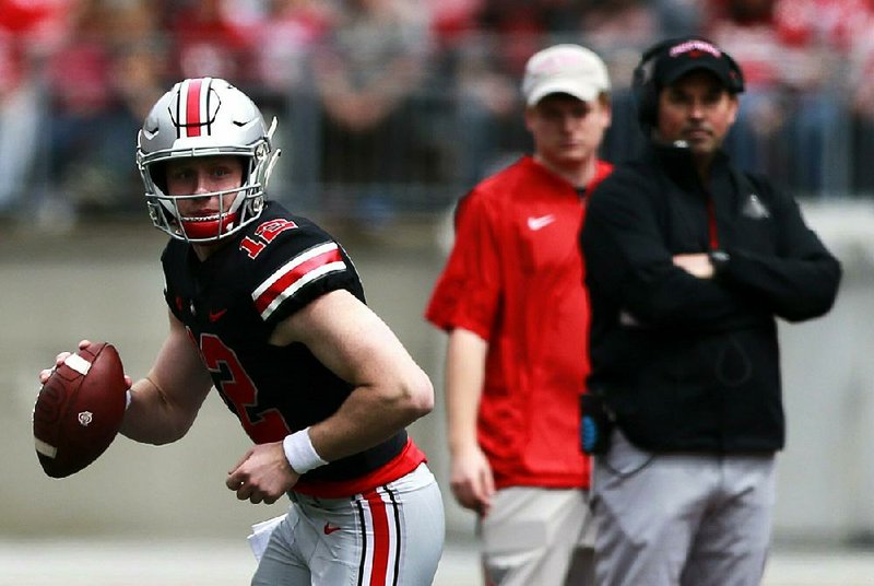 Ohio State Coach Ryan Day watches as quarterback Matthew Baldwin looks to pass during Saturday’s spring game at Ohio Stadium in Columbus, Ohio. Baldwin, who spent last season rehabbing a knee injury, will vie for the starting job with Justin Fields, a Georgia transfer and former five-star recruit in 2018. 