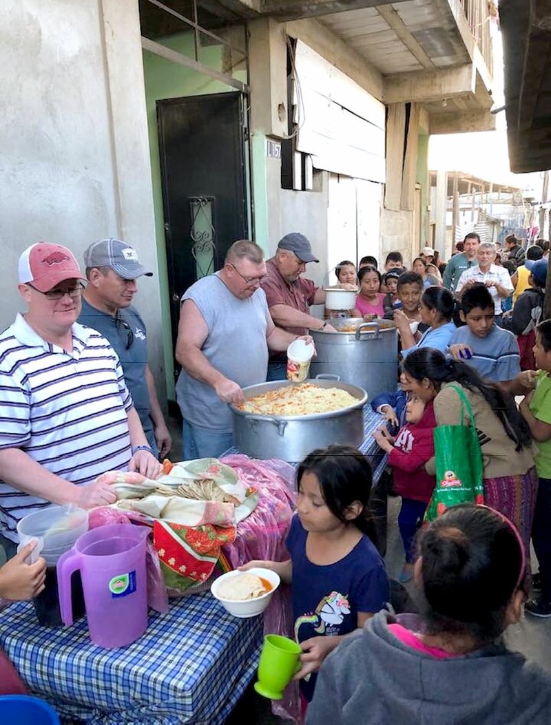 Photo submitted Members of the first men's group from Dustin's Dream to take a trip to the Heart of Love Clinic in Guatemala City in February participated in providing meals for members of the community. The group was led by Don Chamberlain and included members of the Orchard View Church in Colcord, Okla.