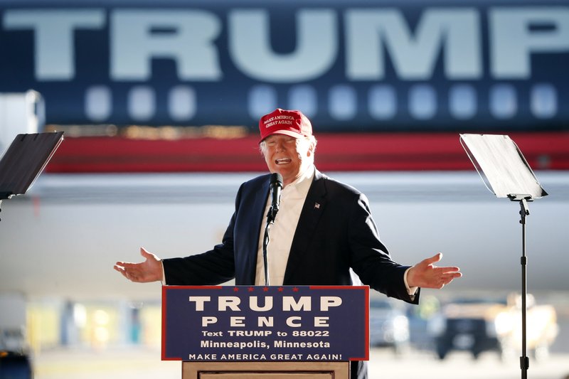 FILE - In this Sunday, Nov. 6, 2016 file photo, Republican presidential candidate Donald Trump addresses the crowd during a campaign stop at the Minneapolis International Airport. On Monday, April 15, 2019, President Trump is travelling to Minnesota, where he lost to Hillary Clinton by fewer than 45,000 votes in 2016, but his re-election campaign is also targeting New Mexico, Nevada, and New Hampshire _ all states where he trailed by under 100,000 votes. (AP Photo/Charles Rex Arbogast)