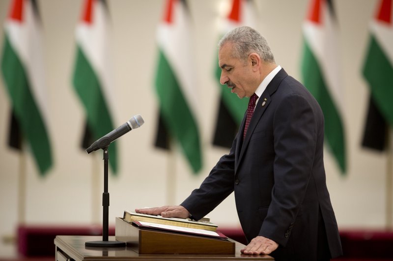 Palestinian Prime Minister Mohammad Ishtayeh talks during a swearing in of the new government in the West Bank city of Ramallah, Saturday, April 13, 2019.(AP Photo/Majdi Mohammed)
