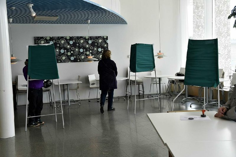 Finnish voters cast their parliamentary-election ballots Sunday at a polling site in Mantsala. 