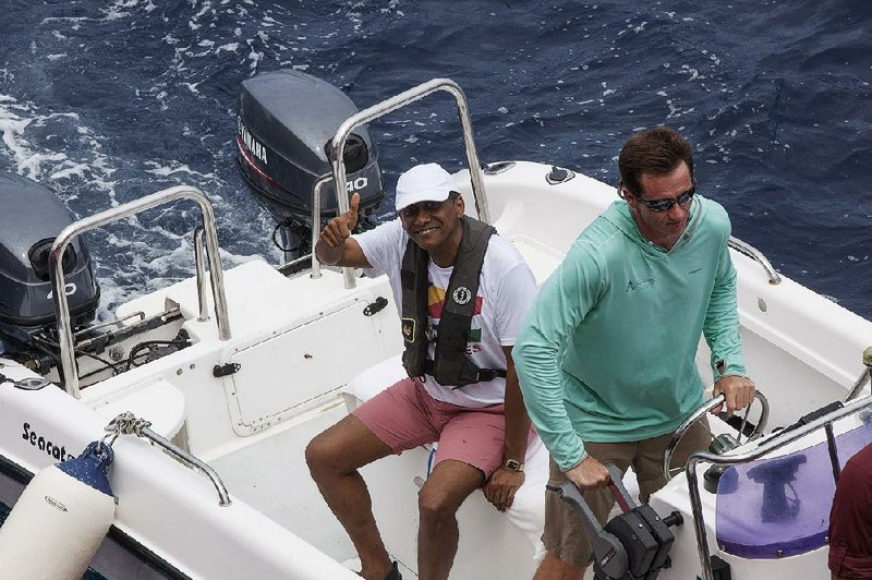 Seychelles President Danny Faure (left) returns Sunday from a speech delivered in an underwater submersible, during which he argued that “we are running out of excuses to not take action” to protect the world’s oceans. 