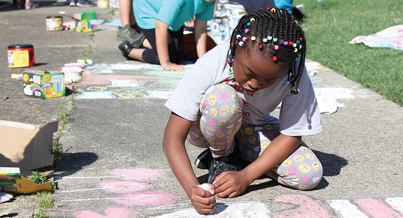 The Sentinel-Record/File photo CHALK WALK: In this May 5, 2018, file photo, Samya Scaggs, a fourth-grader with Hot Springs Langston Magnet School, creates a chalk drawing of Dr. Suess during Art Springs, a free outdoor juried art festival and showcase held at Hill Wheatley Plaza as part of Arts &amp; The Park. This year, Art Springs will take place April 27-28, the opening weekend of the 10-day Arts &amp; The Park festival.