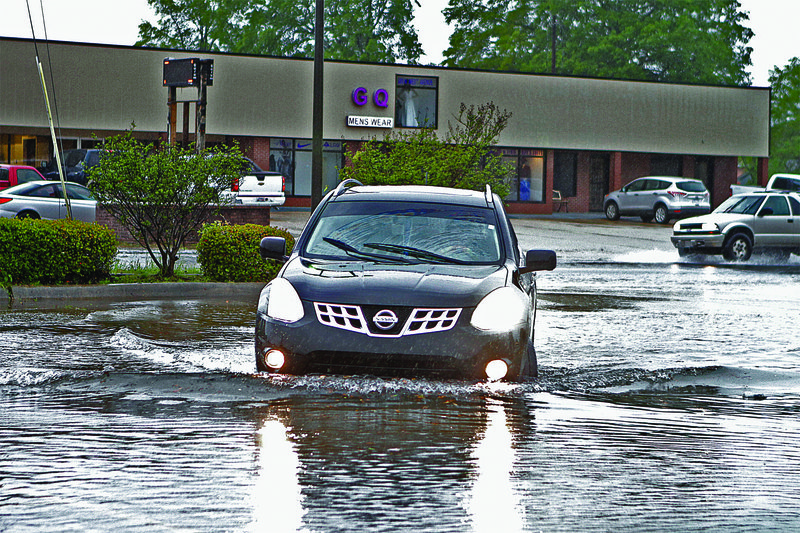 Flood: A vehicle encounters high water as it exits North West Avenue on Saturday.