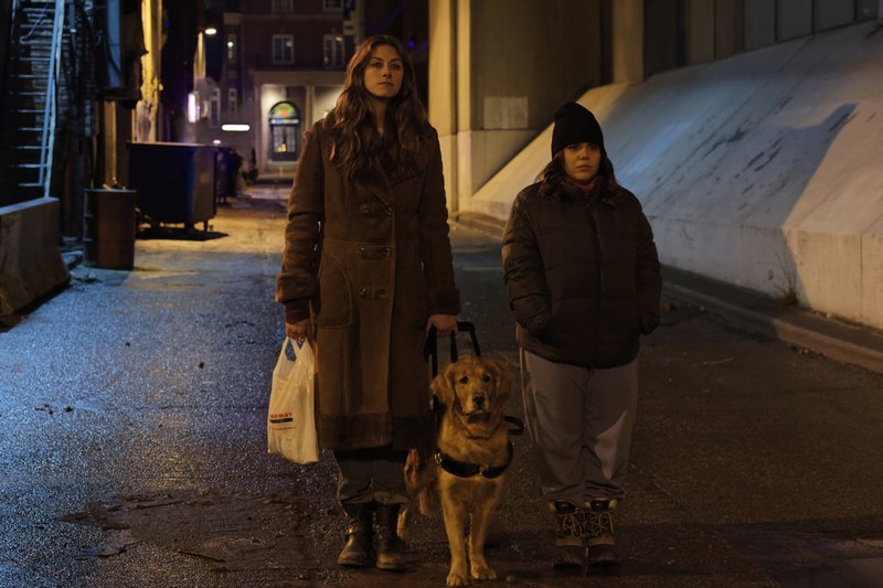 Perry Mattfield stars as Murphy and Brooke Markham is Jess in the CW series In the Dark. Mattfield plays a hard-drinking, chain-smoking blind woman who lives with her best friend, Jess, and her guide dog, Levi. Photo by Ben Mark Holzbert via The CW