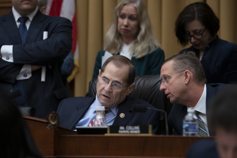 House Judiciary Committee Chair Jerrold Nadler, D-N.Y., joined at right by Ranking Member Doug Collins, R-Ga., confer before a resolution was passed to subpoena special counsel Robert Mueller's full report, on Capitol Hill in Washington, Wednesday, April 3, 2019. (AP Photo/J. Scott Applewhite)