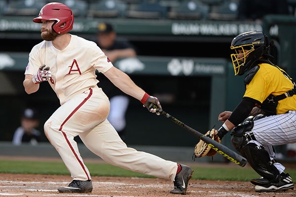 Arkansas second baseman Trevor Ezell connects with the ball Tuesday, April 16, 2019, during the second inning against Arkansas-Pine Bluff at Baum-Walker Stadium in Fayetteville. 