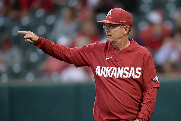Arkansas coach Dave Van Horn gestures to his infield Tuesday, April 16, 2019, during the third inning against Arkansas-Pine Bluff at Baum-Walker Stadium in Fayetteville.