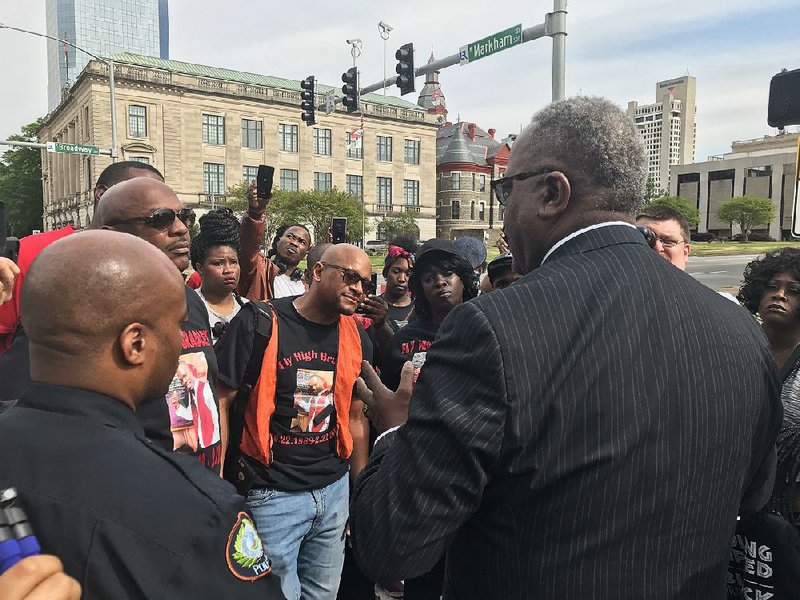 Little Rock Police Chief Keith Humphrey talks to protesters Tuesday outside City Hall. Prompted by the fatal shooting in February of Bradley Blackshire, the group was demanding body cameras for officers and implementation of a citizens review board. 