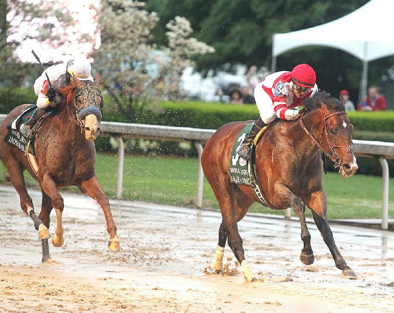 FILE - Omaha Beach (right) won the Arkansas Derby at Oaklawn Park in Hot Springs on April 13, 2019.