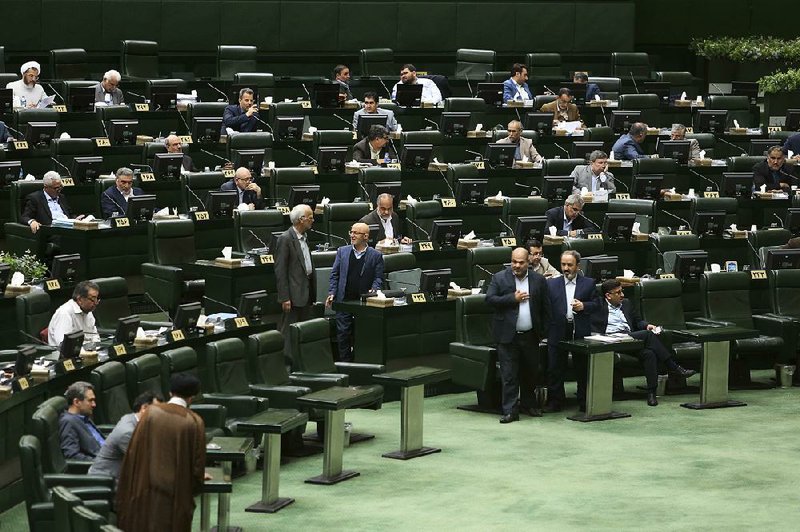 Iranian lawmakers attend a session of parliament in Tehran on Tuesday. 