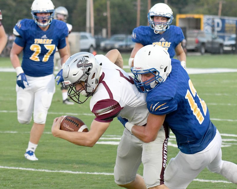 Bud Sullins/Special to the Herald-Leader Cam Collins drags a Pryor, Okla., defender during the 2018 season opener at Pryor. Collins is expected to help the Panthers on offense and defense for the 2019 football season.