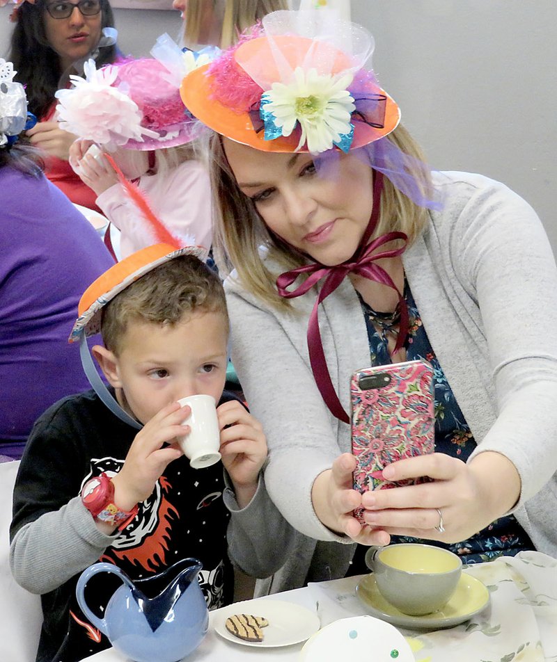 Westside Eagle Observer/RANDY MOLL Erica Fox takes a selfie with Jaxon Dennison, 4, during the Mommy and Me Tea Party on Friday at the Gentry Early Learning Academy. The event has been an annual activity at the academy for the last few years. It gave mothers the opportunity to enjoy a special time with their youngsters, and the children worked hard to prepare a song and make the special hats for the tea party.