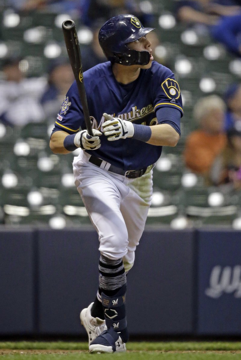 The Associated Press IT'S OUTTA HERE: Milwaukee Brewers' Christian Yelich watches his home run against the St. Louis Cardinals during the eighth inning of Monday's game in Milwaukee. It was Yelich's third home run of the game.