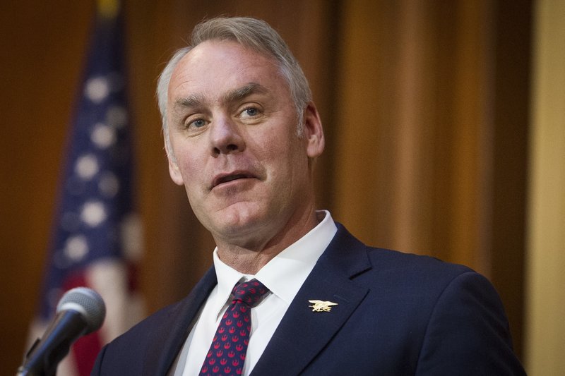 FILE - In this Dec. 11, 2018 file photo, then-Secretary of the Interior Ryan Zinke speaks at EPA headquarters in Washington. Zinke has landed a more than $100,000-a-year job with a Nevada gold-mining firm. Zinke confirmed by phone Tuesday, April 16, he has accepted a consulting and board position with U.S. Gold Corp., a company with business before Zinke's former agency, the Interior Department. (AP Photo/Cliff Owen, File)