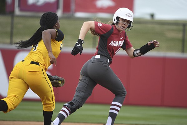 Arkansas baserunner Danielle Gibson tries to avoid the tag from Arkansas-Pine Bluff infielder Alexandria Taylor as she gets caught in a run down during an NCAA softball game on Tuesday, April 16, 2019 in Fayetteville. (AP Photo/Michael Woods)

