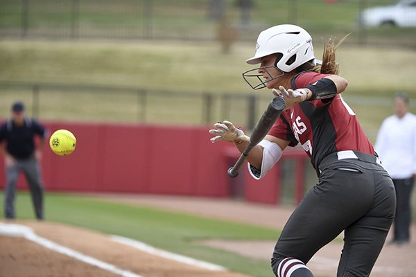 Arkansas batter Sydney Parr lays down a bunt against Arkansas-Pine Bluff during an NCAA softball game on Tuesday, April 16, 2019 in Fayetteville. (AP Photo/Michael Woods)

