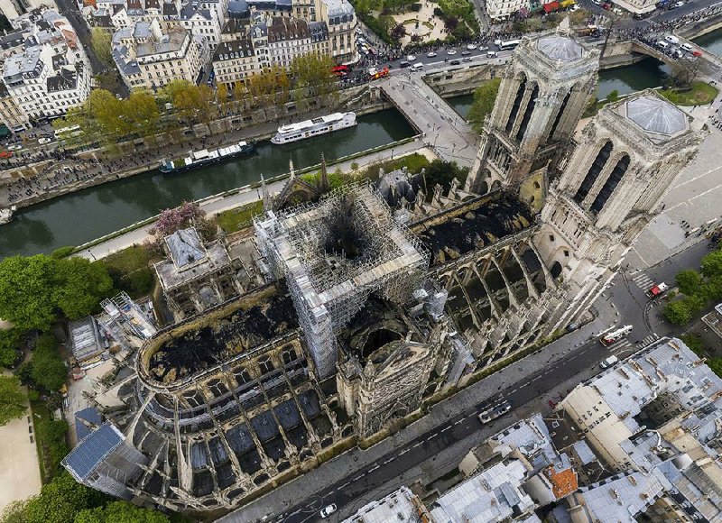 An aerial view Wednesday from the skies of Paris shows the extensive damage to Notre Dame Cathedral. 