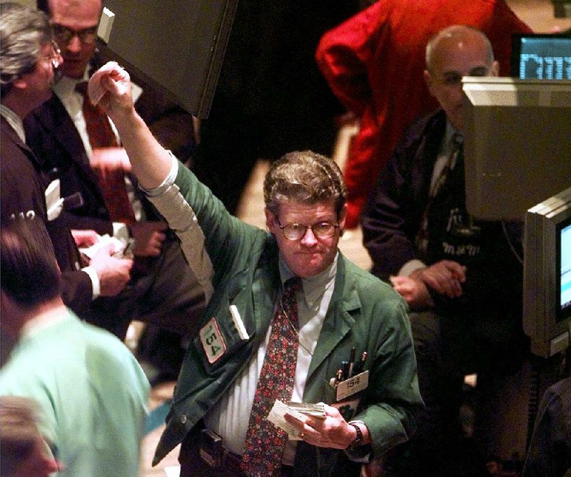 Traders work on the floor of the New York Stock Exchange in June 1998, when the Standard & Poor’s 500 stock index was at a record high and the U.S. economy was in the middle of one of the longest expansions on record. 