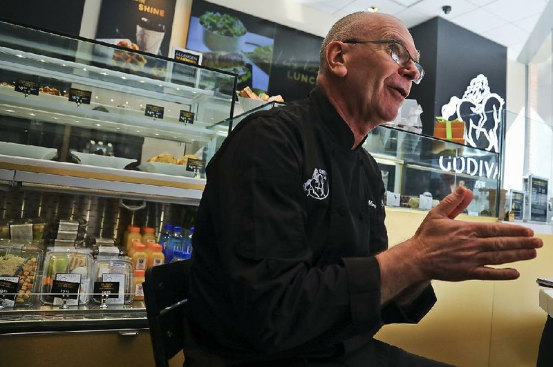 Thierry Muret, executive chef chocolatier at Godiva, talks Tuesday at the company’s new cafe in New York, one of 2,000 specialty cafes the global chocolate maker plans to open the next six years. 