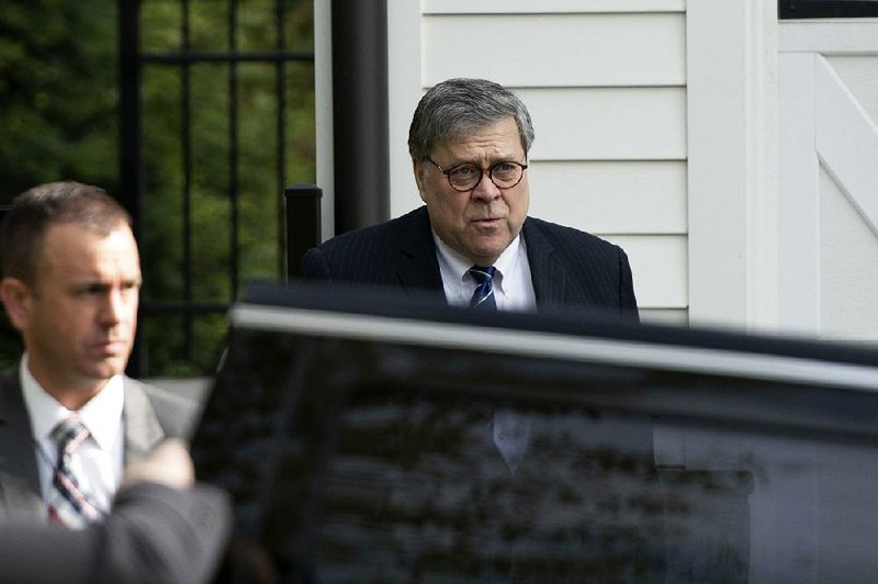 Attorney General William Barr leaves his home Wednesday in McLean, Va. Barr faces scrutiny in Washington over his handling of Robert Mueller’s report. 