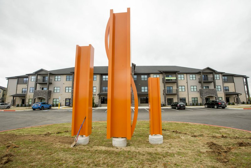 NWA Democrat-Gazette/BEN GOFF @NWABENGOFF A sculpture stands at the entrance Wednesday at I Street Modern Apartments in Bentonville. The complex near the Bentonville Community Center opened in February. The Fayetteville-Springdale-Rogers Metropolitan Statistical Area area grew from 538,412 in 2017 to 549,128 in 2018, according to the Census report. The region was the 43rd fastest growing metro area by population and 27th fastest growing area by percentage of population growth. story.lead_photo.caption