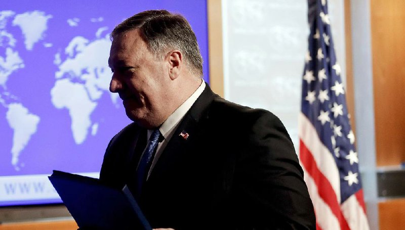 Secretary of State Mike Pompeo wraps up a news conference Wednesday at the State Department after announcing a new policy allowing Americans to sue foreign firms operating on properties Cuba seized after the 1959 revolution. 