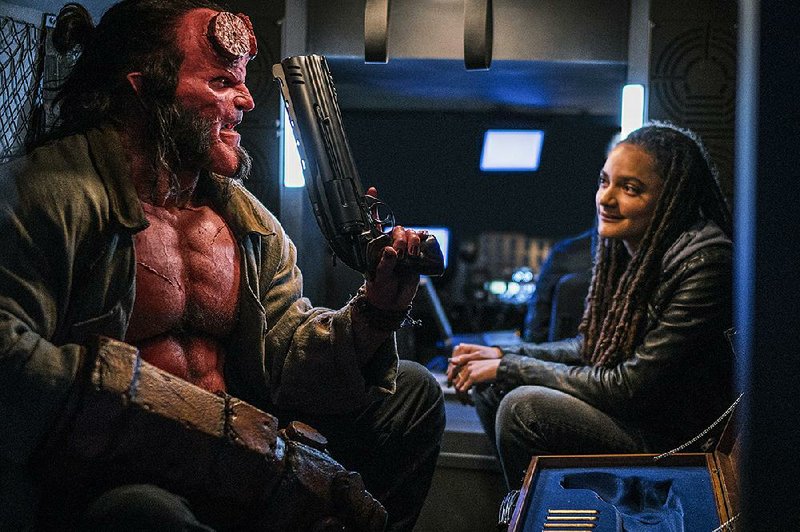 David Harbour (left) and Sasha Lane star in Lionsgate’s reboot of Hellboy. It debuted at No. 3 at last weekend’s box office and made only about $12 million. 