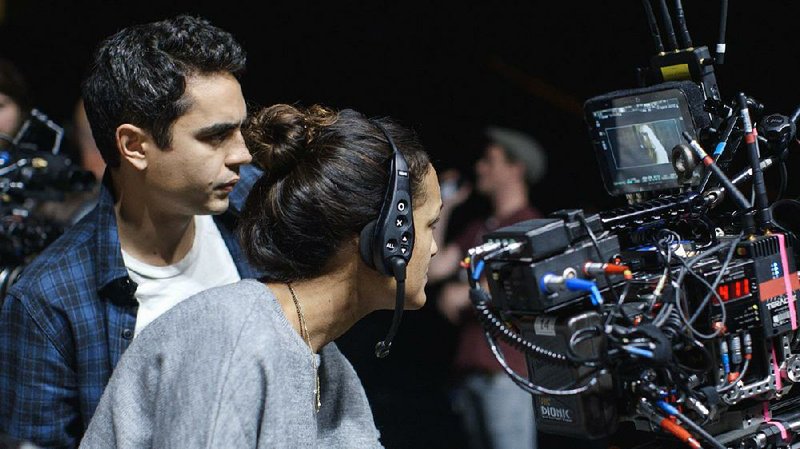 Max Mingehella consults with his cinematographer Autumn Durald on the set of his directorial debut Teen Spirit. 