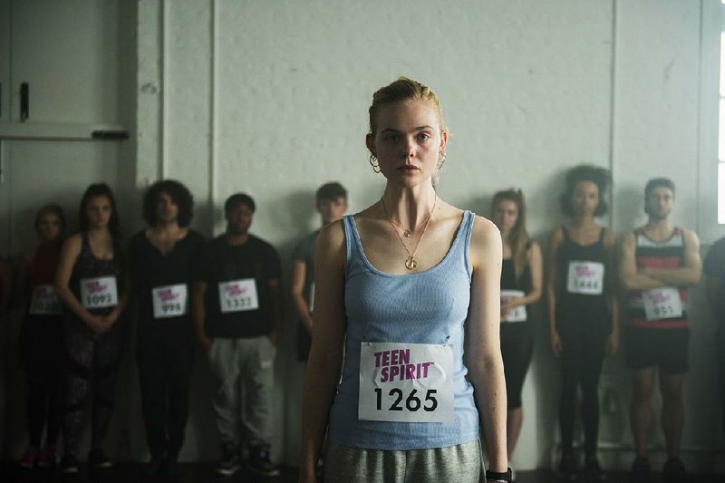 Violet (Elle Fanning) is a poor girl from a remote British island who seizes her chance when an American Idol-like TV show comes to town in Max Minghella’s Teen Spirit. 