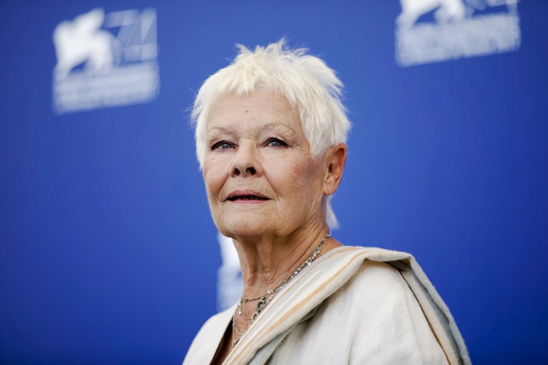 The Associated Press FAR CRY: In this Sunday, Sept. 3, 2017, file photo, actress Judi Dench poses during a photo call for the film "Victoria And Abdul" at the 74th Venice Film Festival in Venice, Italy. Judi Dench is back in the world of espionage -- but her latest role is a far cry from James Bond's unflappable spy chief, M. In "Red Joan," released in Britain and the U.S. on Friday, Dench plays an elderly British woman whose quiet suburban life is upended when police come knocking, accusing her of passing nuclear secrets to the Soviet Union during the Cold War.