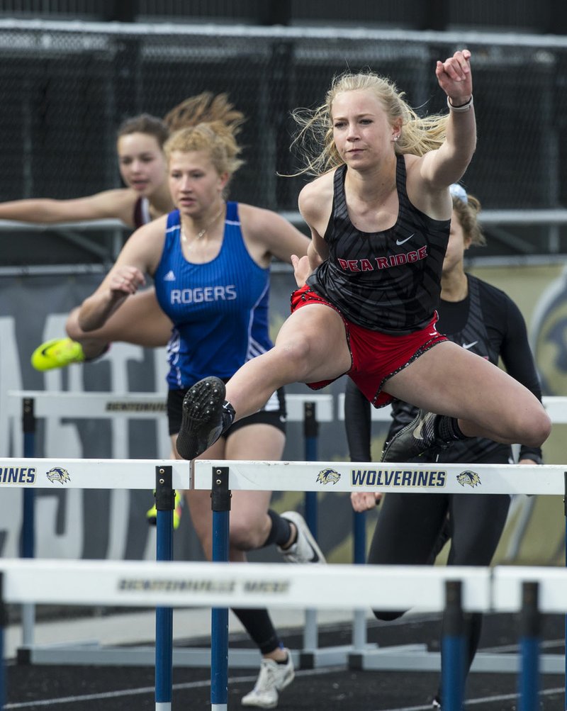 NWA Democrat-Gazette/BEN GOFF @NWABENGOFF Blakelee Winn of Pea Ridge leads the 3rd heat of the girls 100 meter hurdles Thursday, April 18, 2019, during the Wolverine Relays at Bentonville West in Centerton. Winn won with a time of 15.60 seconds.