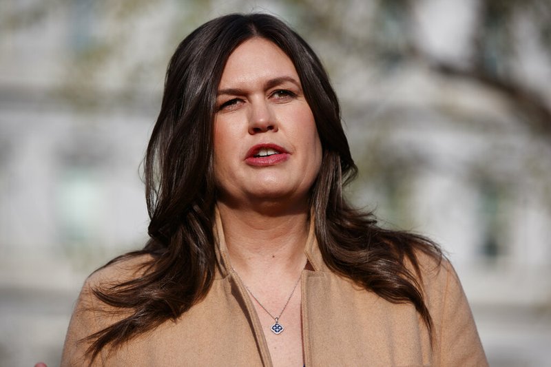 In this April 4, 2019, file photo, White House press secretary Sarah Sanders talks with reporters outside the White House in Washington. (AP Photo/Evan Vucci, File)