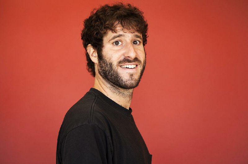 In this Sept. 22, 2015, photo, rapper David Burd, known as Lil Dicky poses for a portrait in promotion of his new music video "$ave Dat Money" in Beverly Hills, Ca 