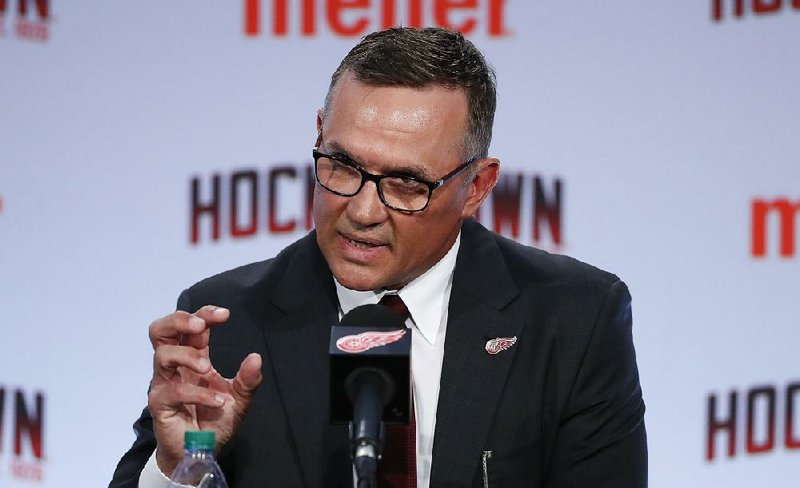 Steve Yzerman answers a question as the new executive vice president and general manager of the Red Wings on Friday in Detroit, where he was a member of three Stanley Cup championship teams. 