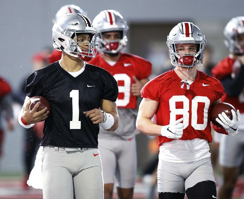 Ohio State quarterback Justin Fields (1) appears to be the new starting quarterback after Matthew Baldwin announced Thursday he was going to transfer. Fields spent the 2018 season as a backup at Georgia before transferring to Ohio State. 